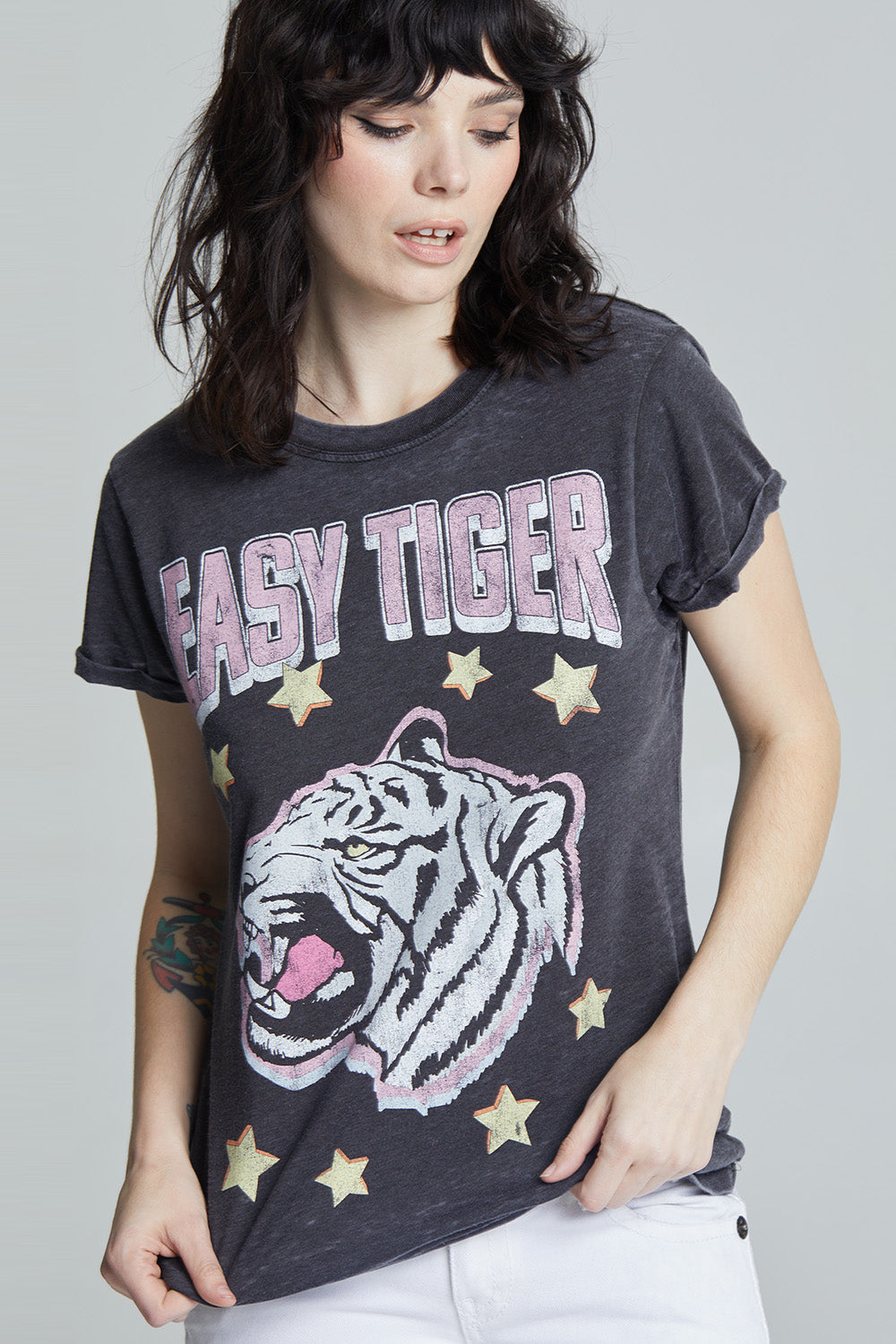 Women's black fitted 'Easy Tiger Star' graphic t-shirt with a black and white tiger, yellow stars, and 'Easy Tiger' text.