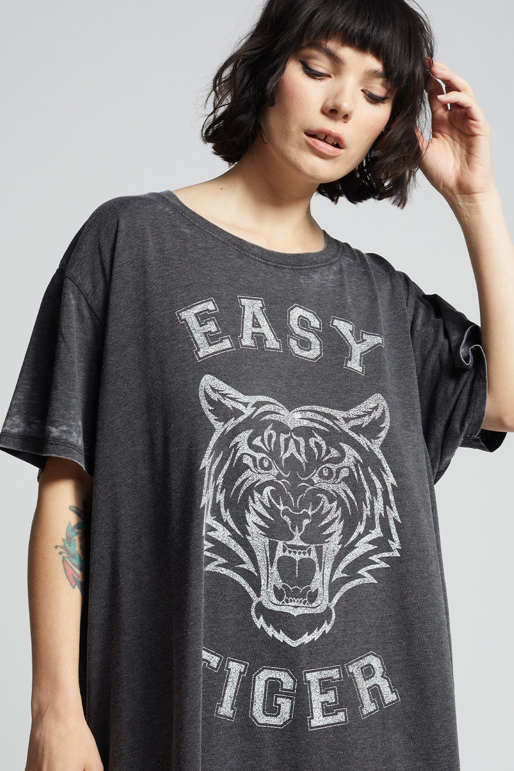 Black oversized 'Easy Tiger' t-shirt dress with a tiger graphic and 'Easy Tiger' text on vintage washed fabric.