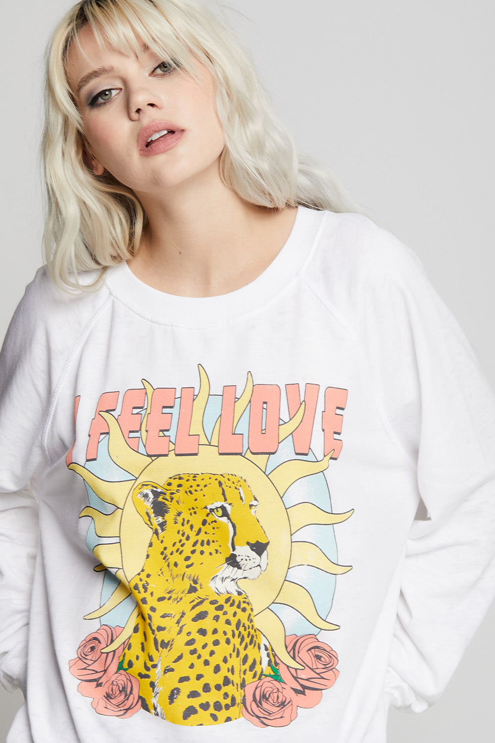 Oversized I Feel Love Sweatshirt in White with cheetah, sun, rose, and text graphics
