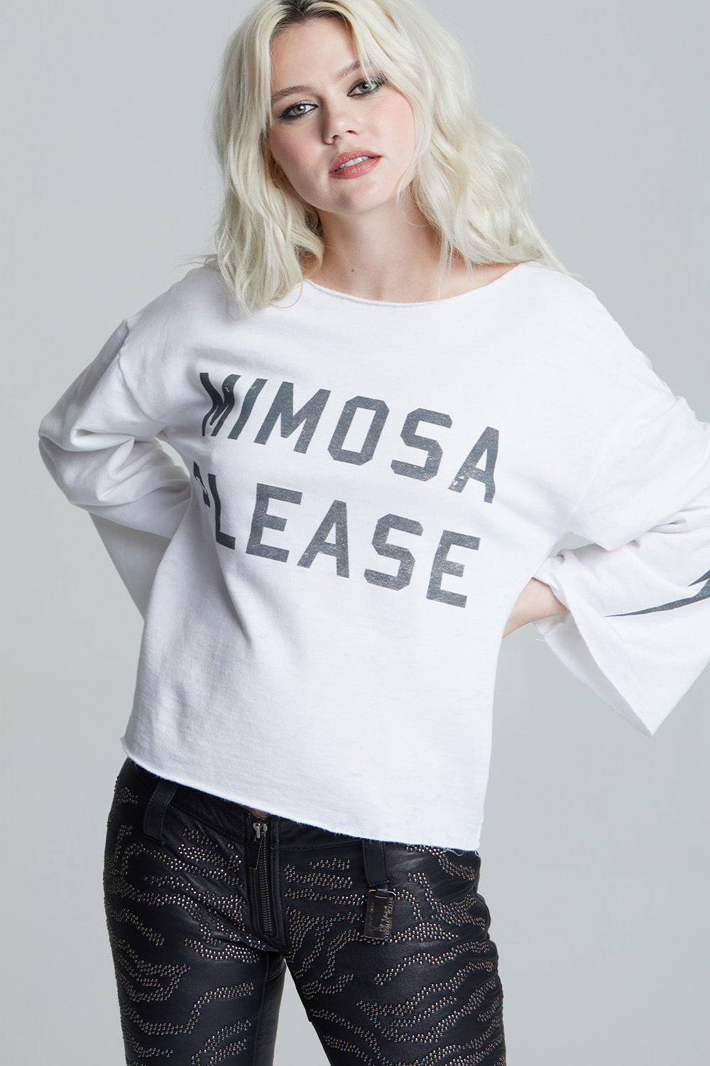 Women's white 'Mimosa Please' bell sleeve top with distressed graphics and a bolt on the sleeve.